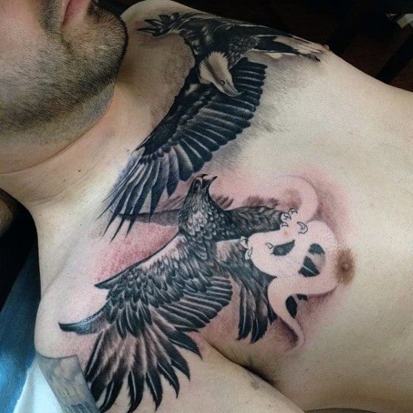 Mexican Eagle Flying With Snake Guys Upper Chest Tattoo