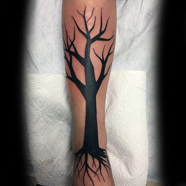 Minimal Tattoo Of Black Ink Tree On Mans Leg