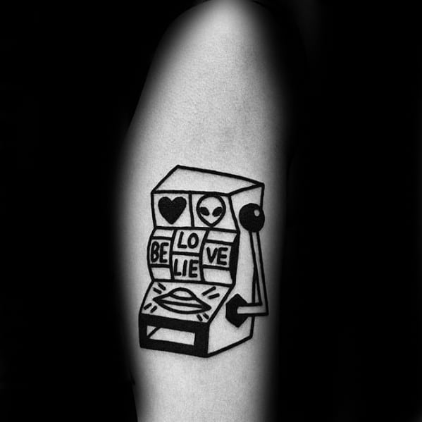 Minimalist Arm Alien Themed Male Slot Machine Tattoo Design Inspiration