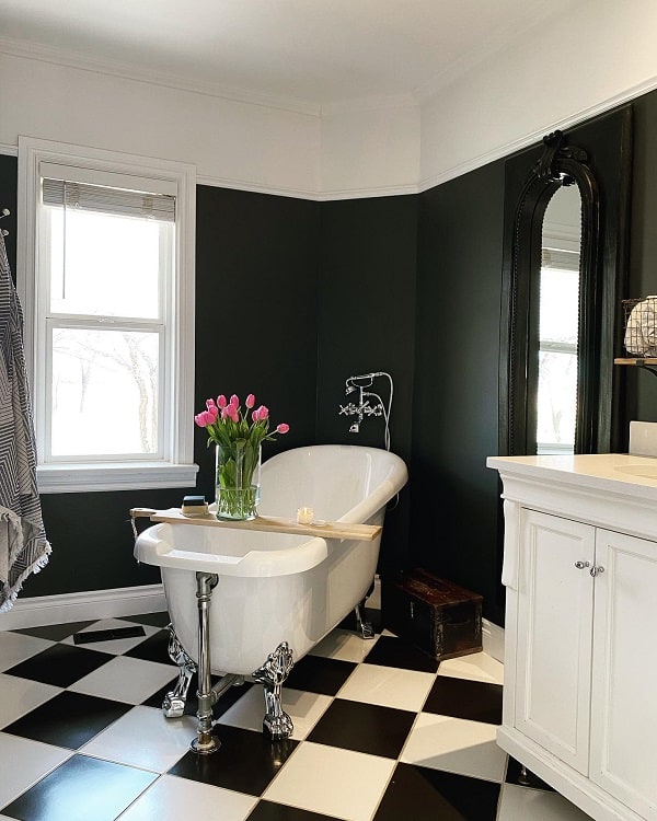 minimalist black white farmhouse bathroom tile freestanding bathtub white vanity 