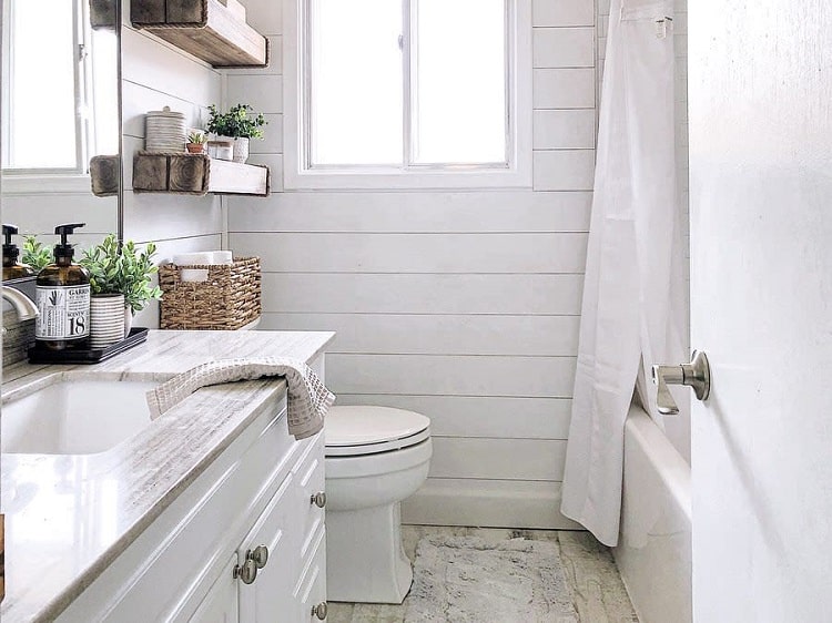 white shiplap bathroom white vanity polished granite top wood wall shelf 