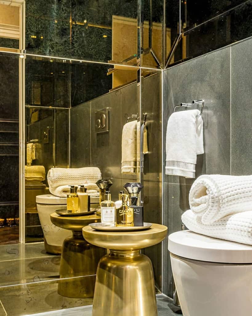 luxurious bathroom with gold stool