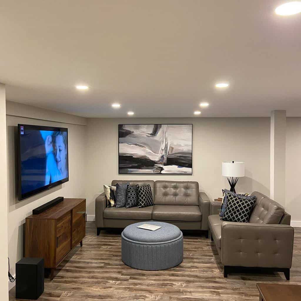 modern basement with grey couch