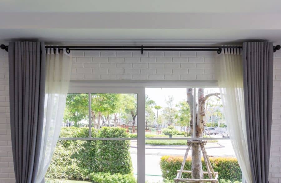 modern gray curtains large window white brick wall