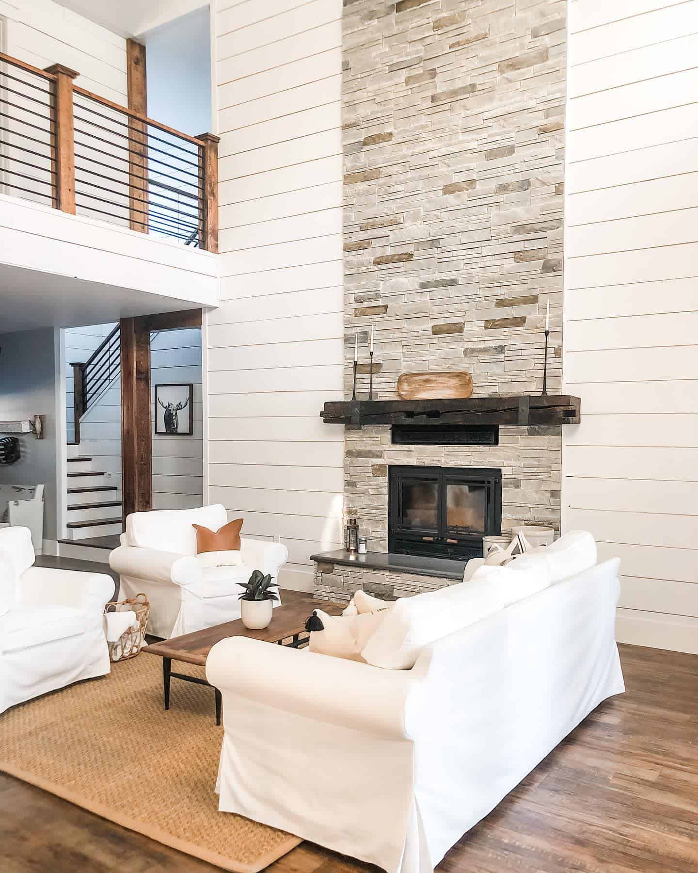 modern farmhouse brick fireplace white sofas hardwood floors