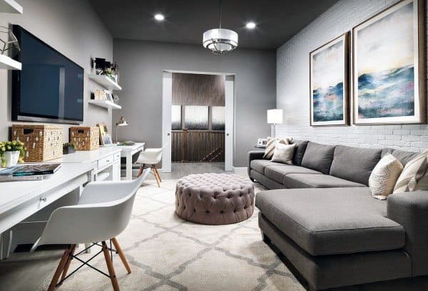 multipurpose spare bedroom with gray sofa and office