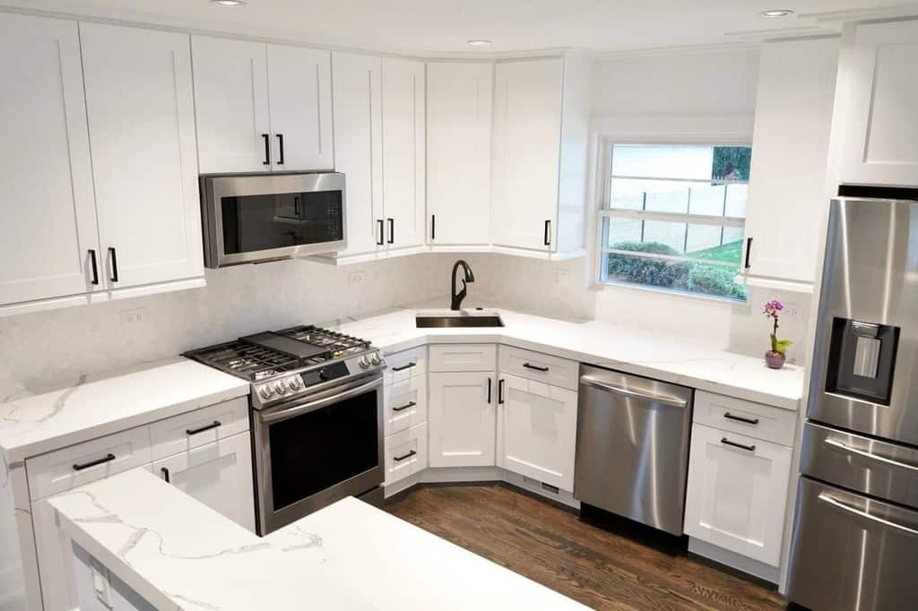 modern white corner kitchenette silver appliances
