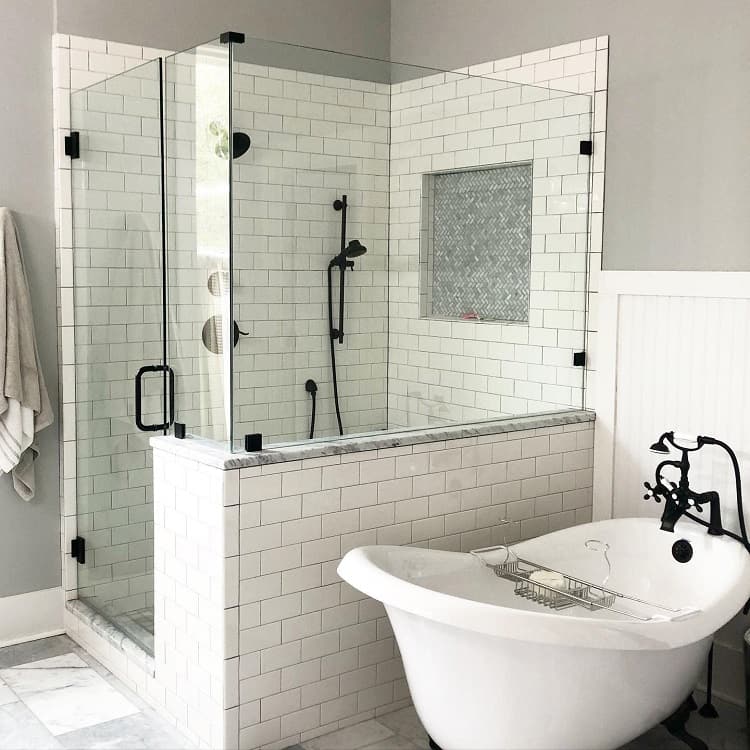 white wall tile bathroom and shower freestanding bathtub 