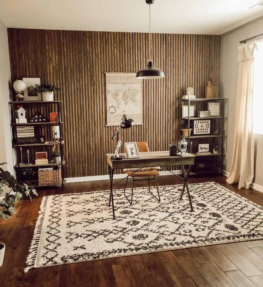 rustic boho office simple wooden desk tan leather chair shelving units black pendant ceiling light floor rug 
