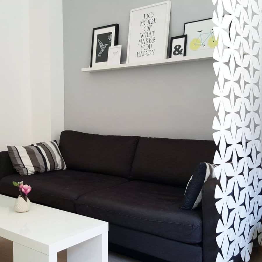 modern white abstract wall divider black sofa