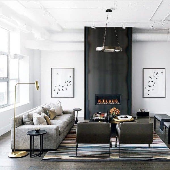 contemporary living room modern fireplace gray sofa gold floor lamp framed artwork 