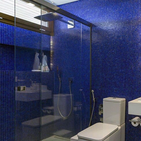 shower with blue tiles