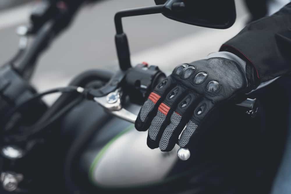 close up of motorcycle rider black gloves
