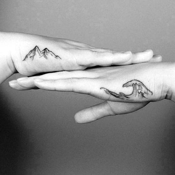 mountain-with-ocean-wave-side-hand-guys-tattoos