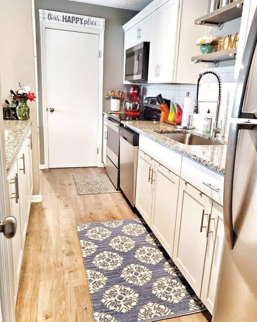 narrow rustic farmhouse kitchen granite countertops white cabinets pattern floor rug