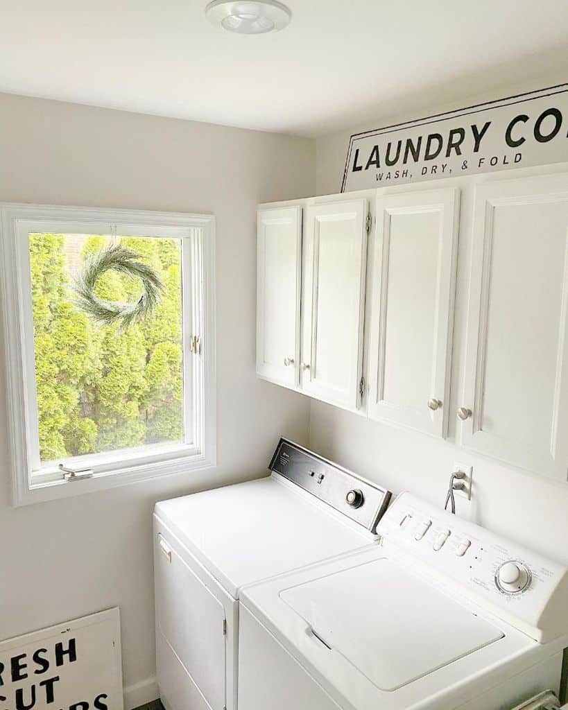simple white cabinet laundry room washer and dryer