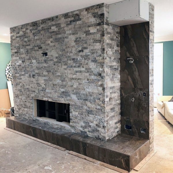 white-washed stone fireplace
