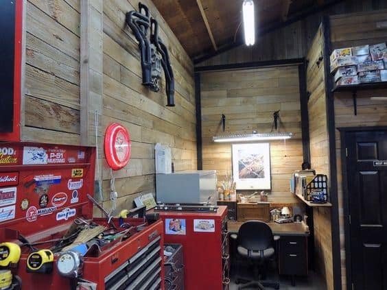 natural wood boards garage wall red tool boxes 