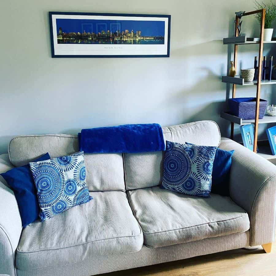 small living room blue features city wall art