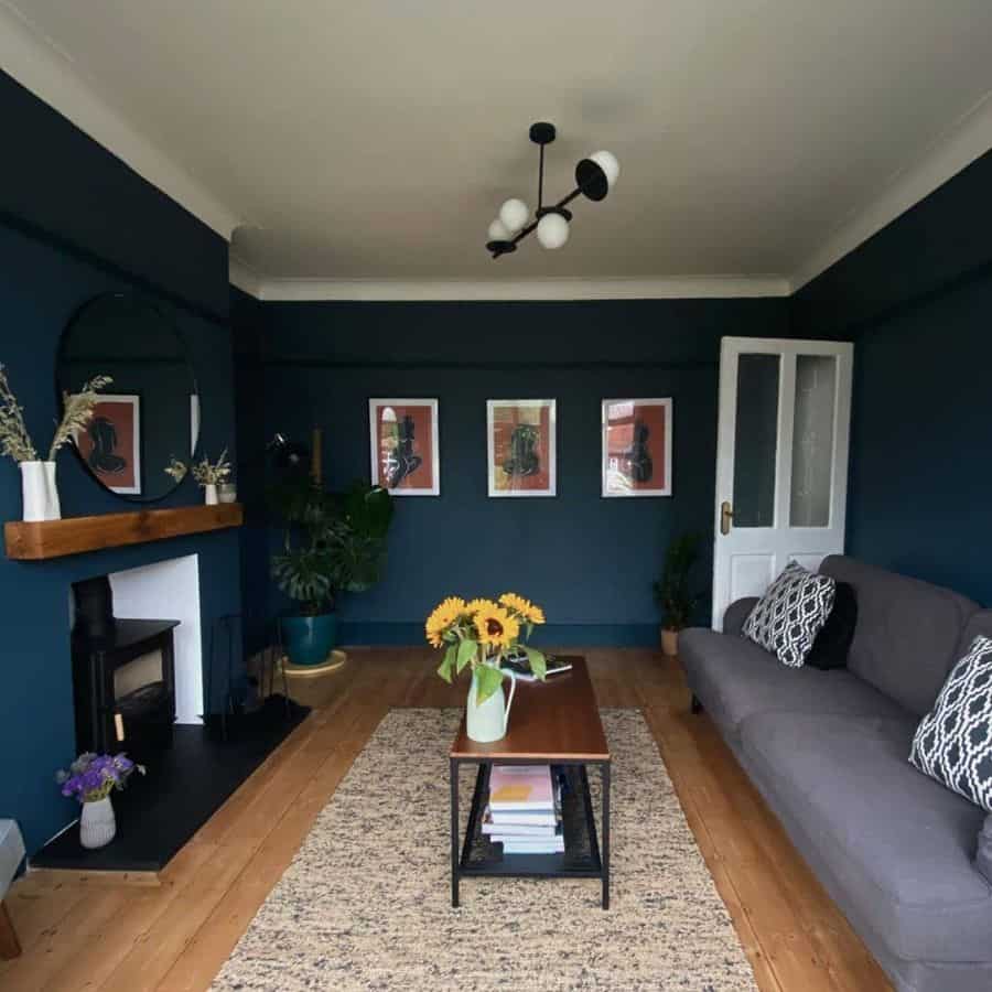 navy blue living room gray couch fireplace 