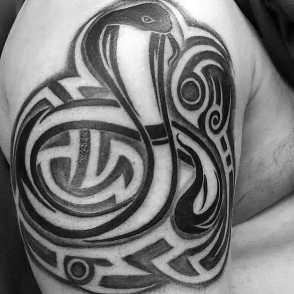 Negative Space Guys Tribal Snake Upper Arm Tattoo