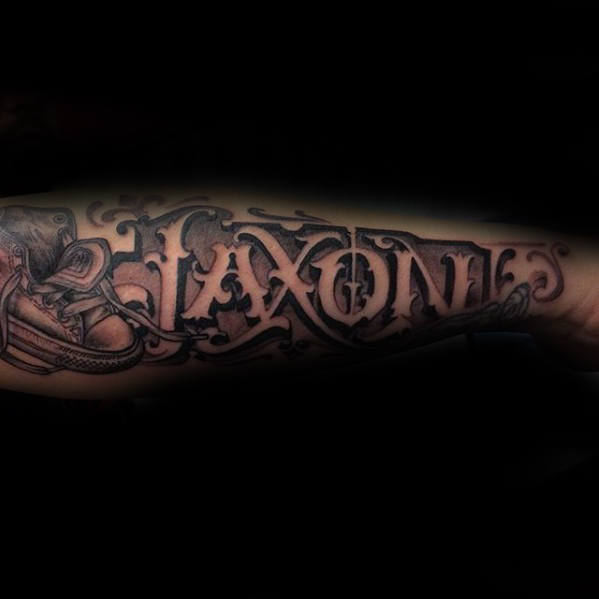 Negative Space Jaxon Guys Outer Forearm Tattoo Of Name