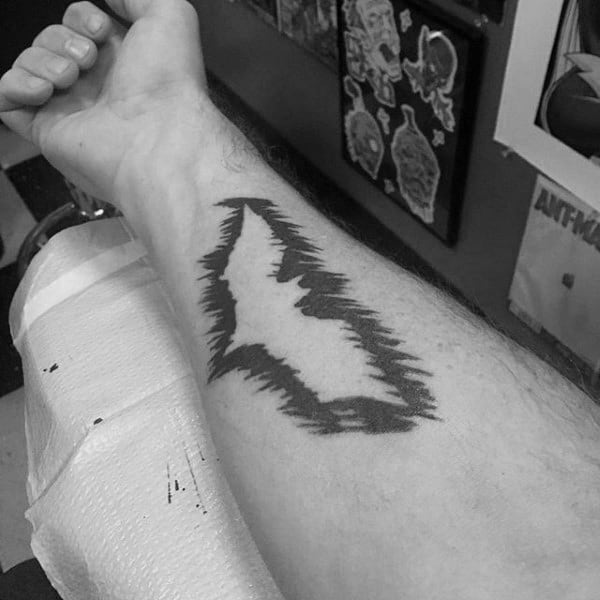 Negative Space Male Batman Symbol Tattoo On Inner Forearm