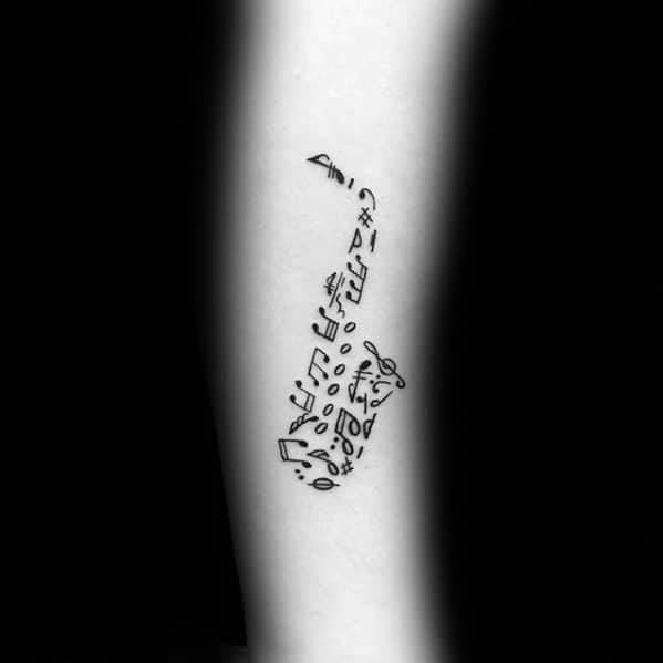 Negative Space Music Notes Saxophone Small Forearm Tattoos For Men
