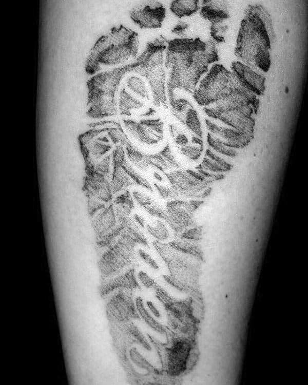 Negative Space Name Footprint Guys Arm Tattoo
