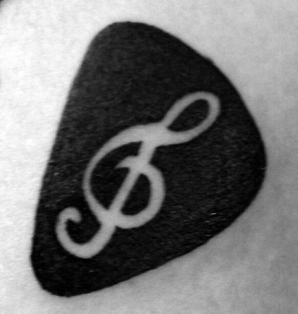 Negative Space Note Inside Guitar Pick Mens Simple Music Chest Tattoo
