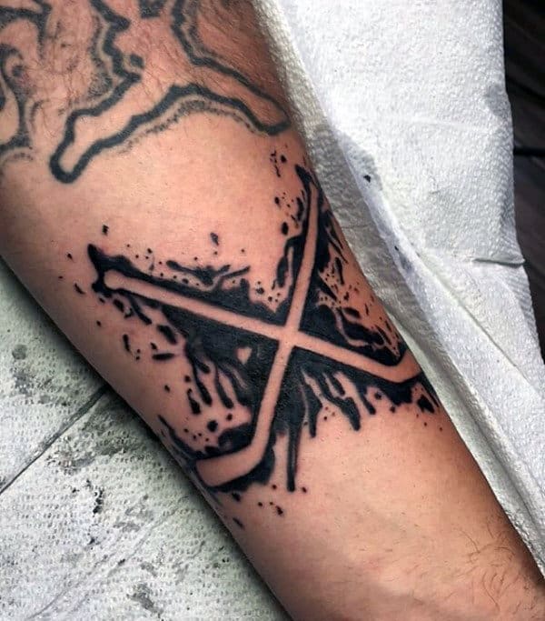 Negative Space Paint Splatter Black Ink Guys Hockey Sticks Tattoo