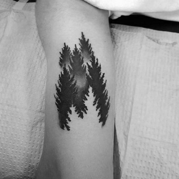 Negative Space Trees Forest Male Inenr Arm Bicep Tattoo With Simple Design