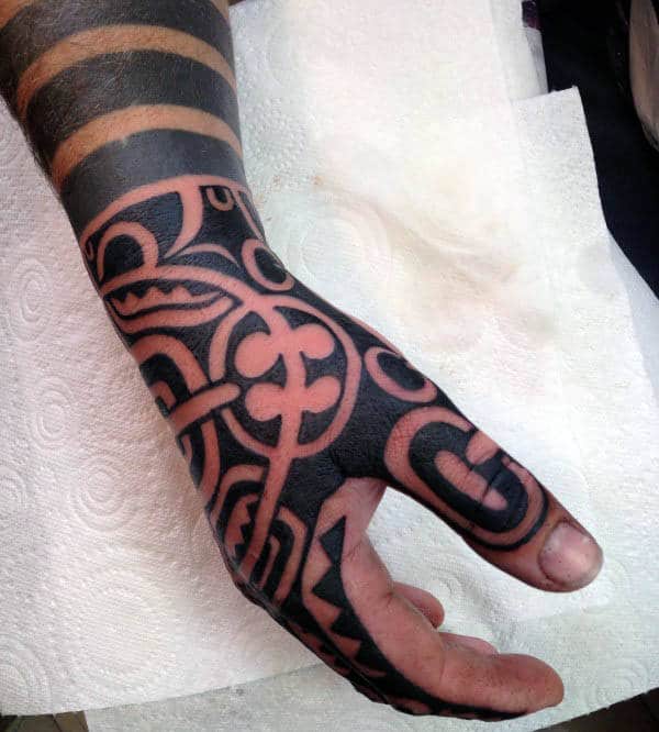 Negative Space Tribal Male Hand Tattoos