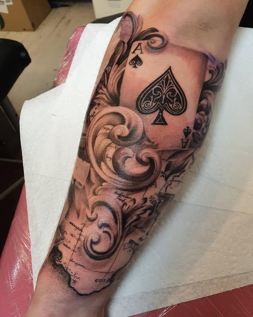 black and red spade tattoo poker player