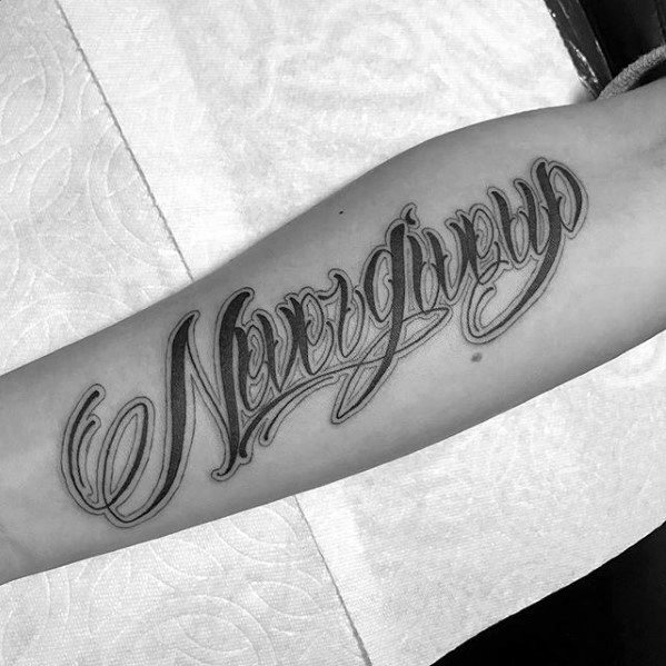 Dont give up lettering tattoo located on the