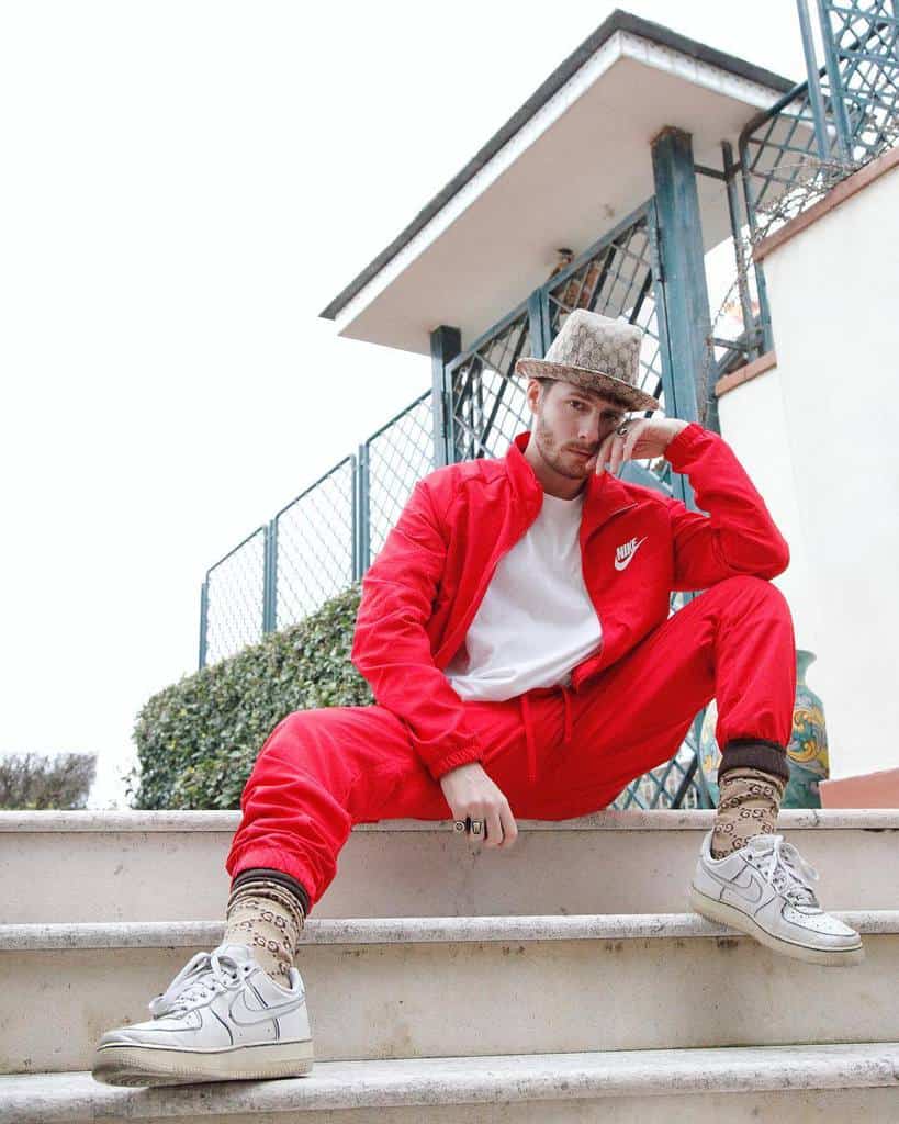 cool red nike jacket and red pants with nice socks and hat