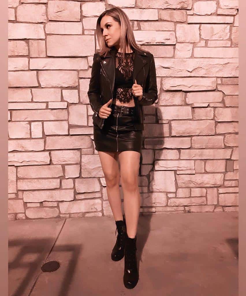 nice black see through top with leather jacket with leather skirt and boots