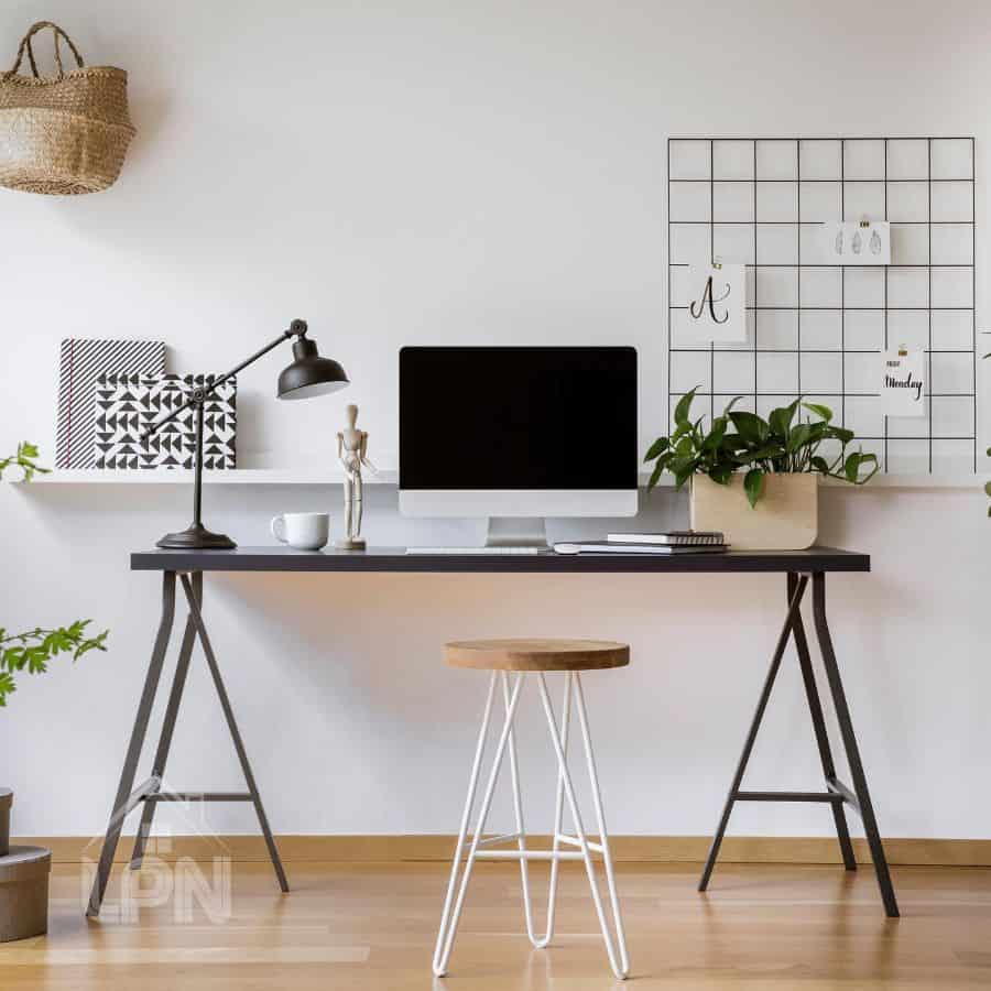 modern home office black desk wood stool black lamp white wall shelf 