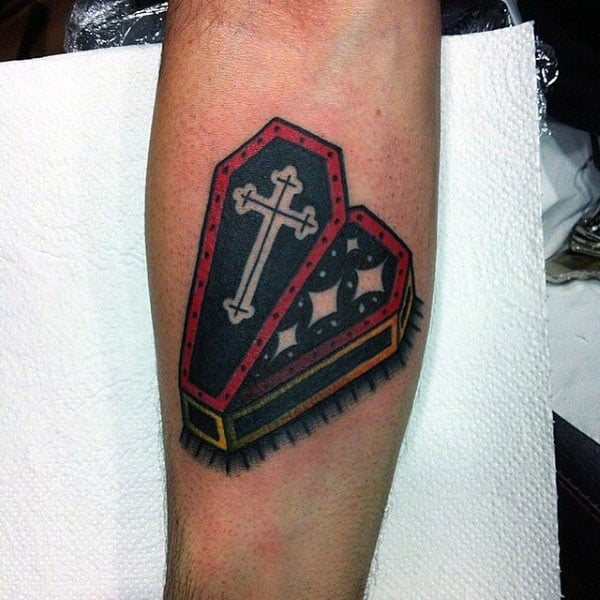 Old School Coffin With Cross And Stars Tattoo On Mans Inner Forearm