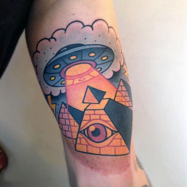 One Eyed Orange Ray From Space Shuttle Tattoo Male Forearms