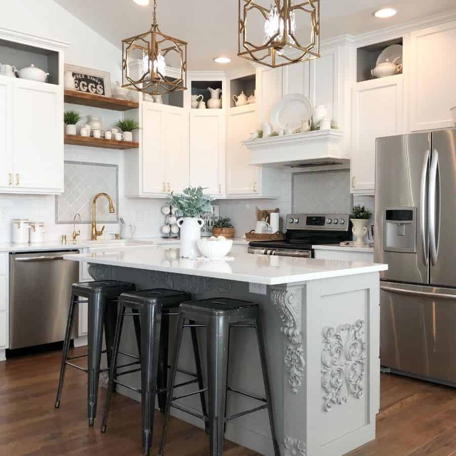 elegant kitchen white cabinets gray island white marble countertop three black metal stools 