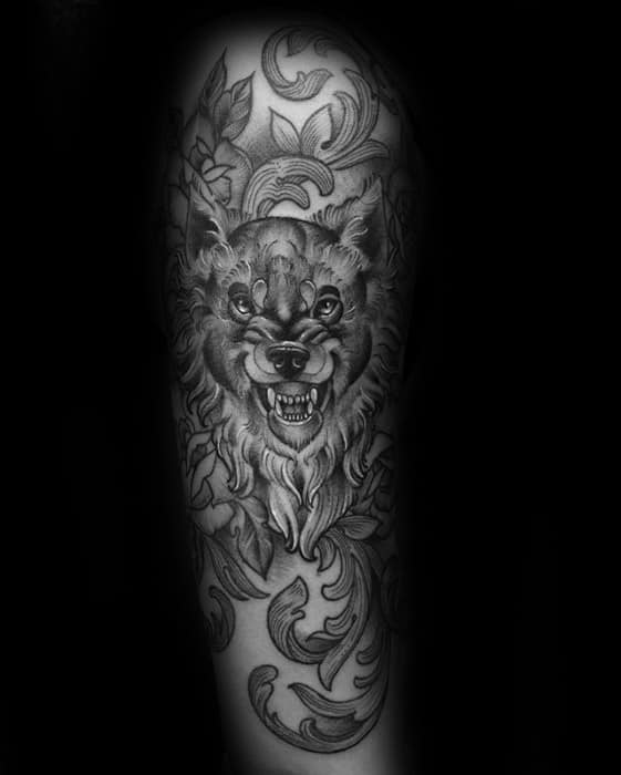 ornate-arm-male-tattoo-with-sick-wolf-design