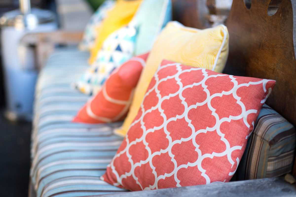 Close,Up,On,Orange,And,Yellow,Pattern,Throw,Pillows,On