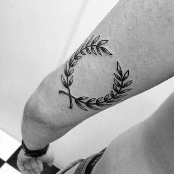 Outer Arm Tricep Male Tattoo With Laurel Wreath Design