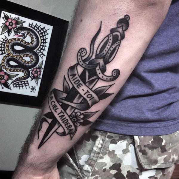 Outer Forearm Black Shaded Banner With Dagger Mens Traditional Tattoo Designs