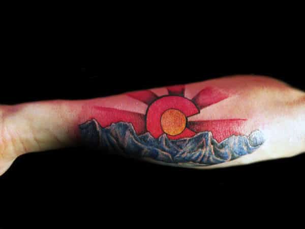 Outer Forearm Blue Mountains With Red Rising Sun Colorado Tattoos For Men
