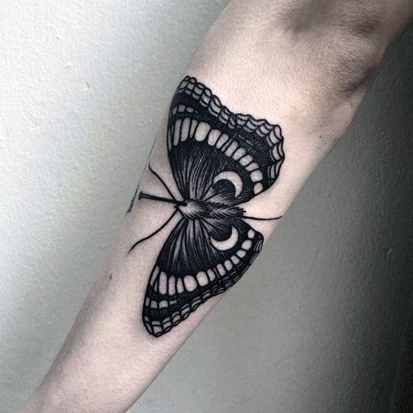 Outer Forearm Moth With Negative Space Moons Mens Tattoo Ideas