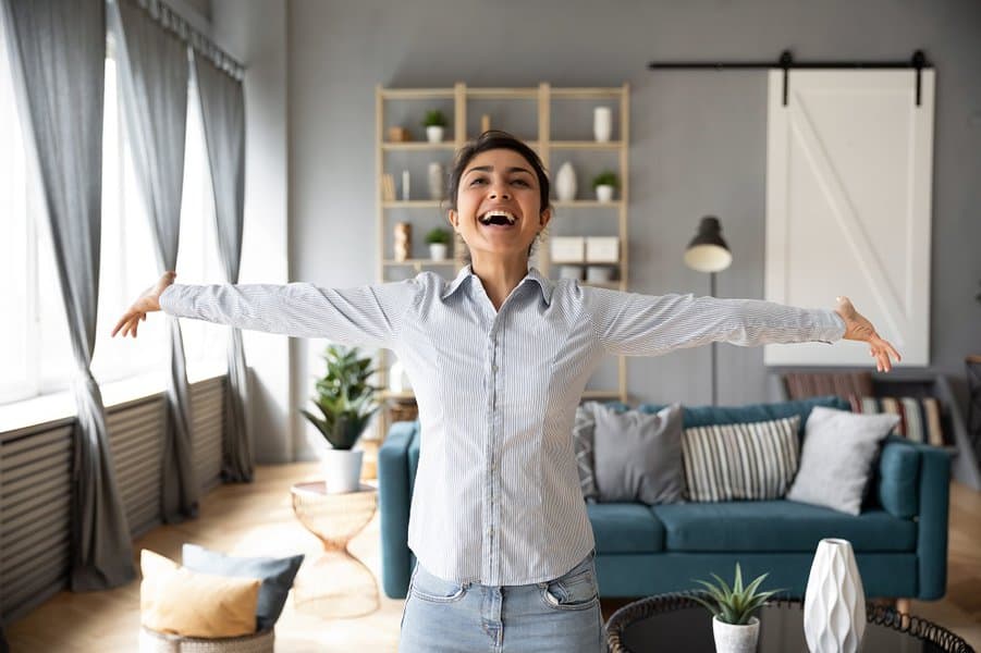 overjoyed young woman at home