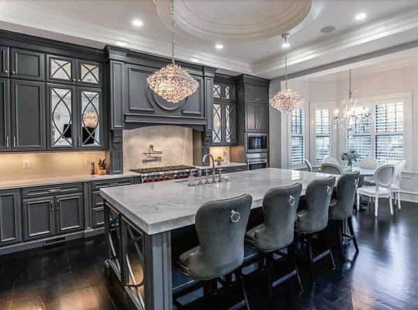 large gray cabinet kitchen with island and four seats chandelier