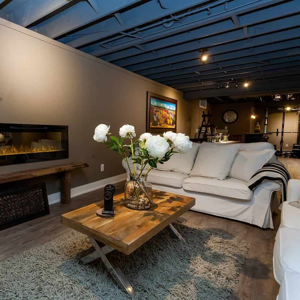 basement living room with gas fireplace 